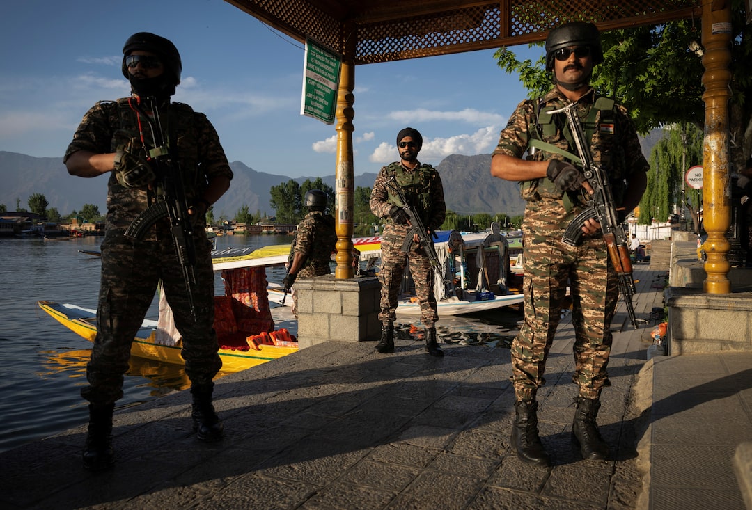 Indian security personnel stand guard in Srinagar